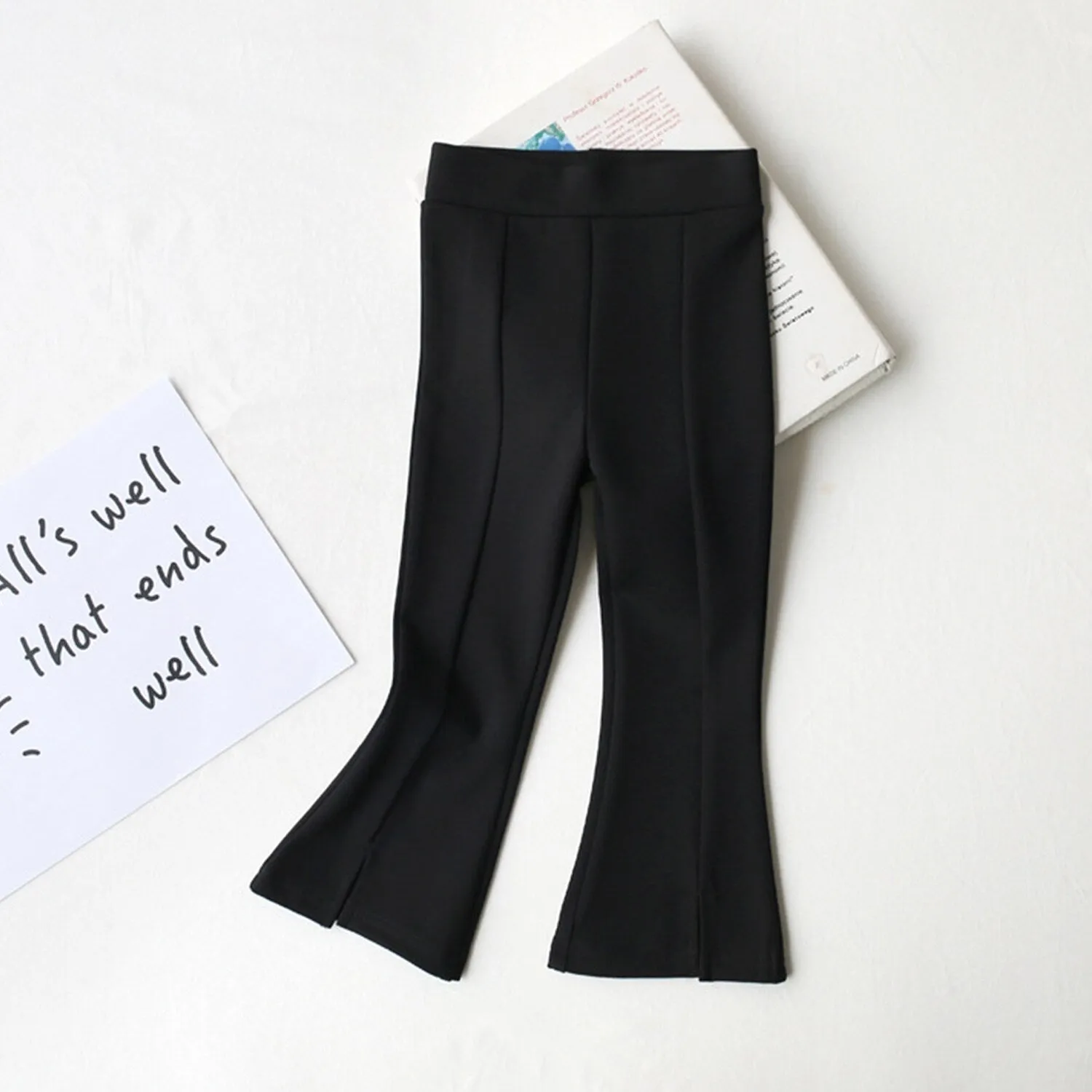 Black Slit Flared Pants sold by Zulily