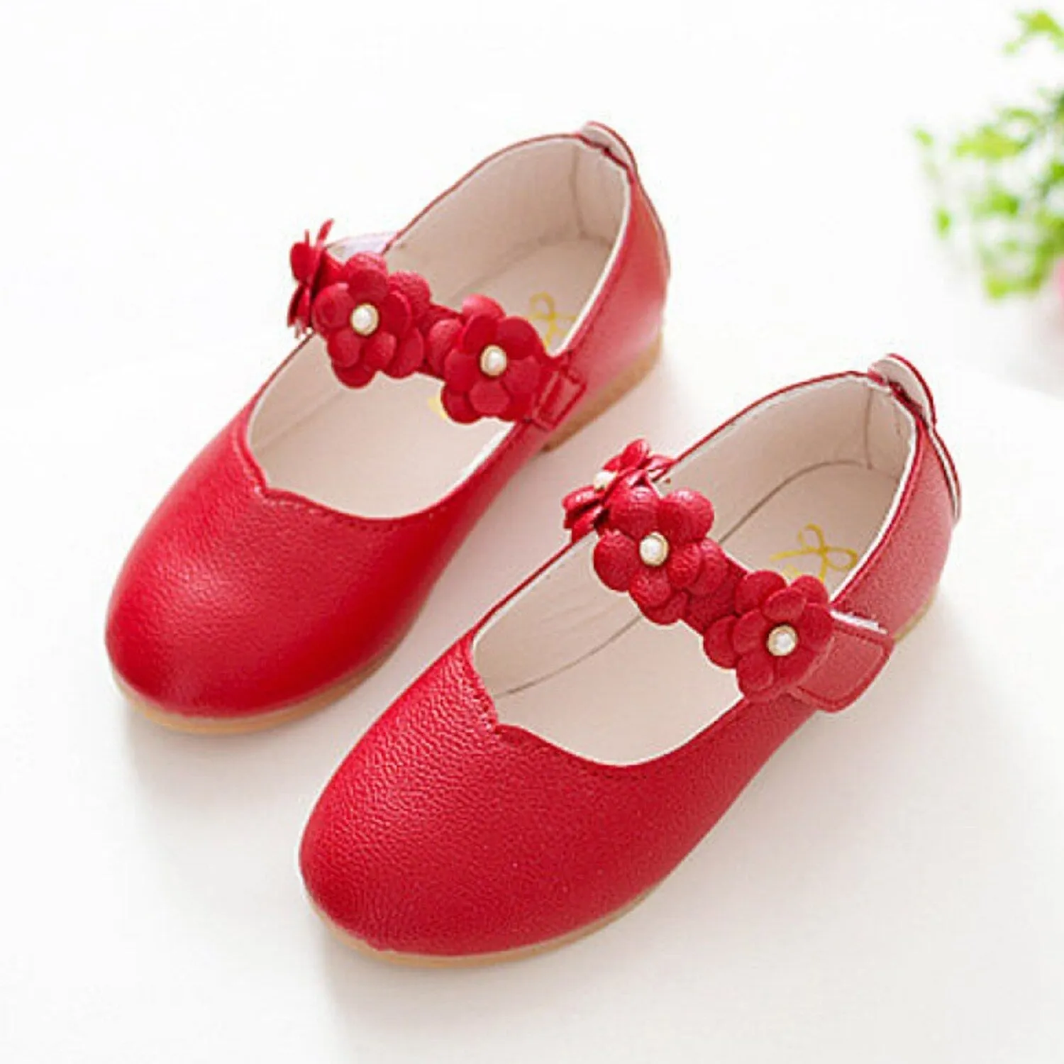 Red Floral Girls' Flat Shoes sold by Zulily
