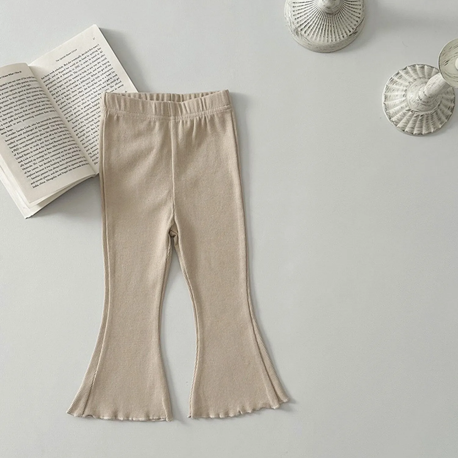 Beige Flared Pants sold by Zulily