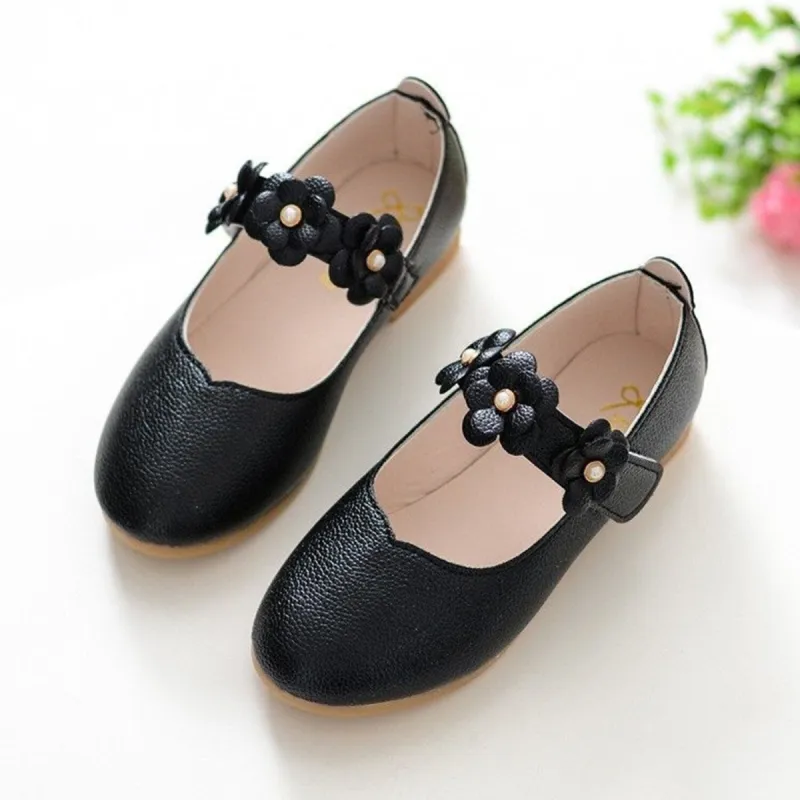Black Floral Girls' Flat Shoes sold by Zulily