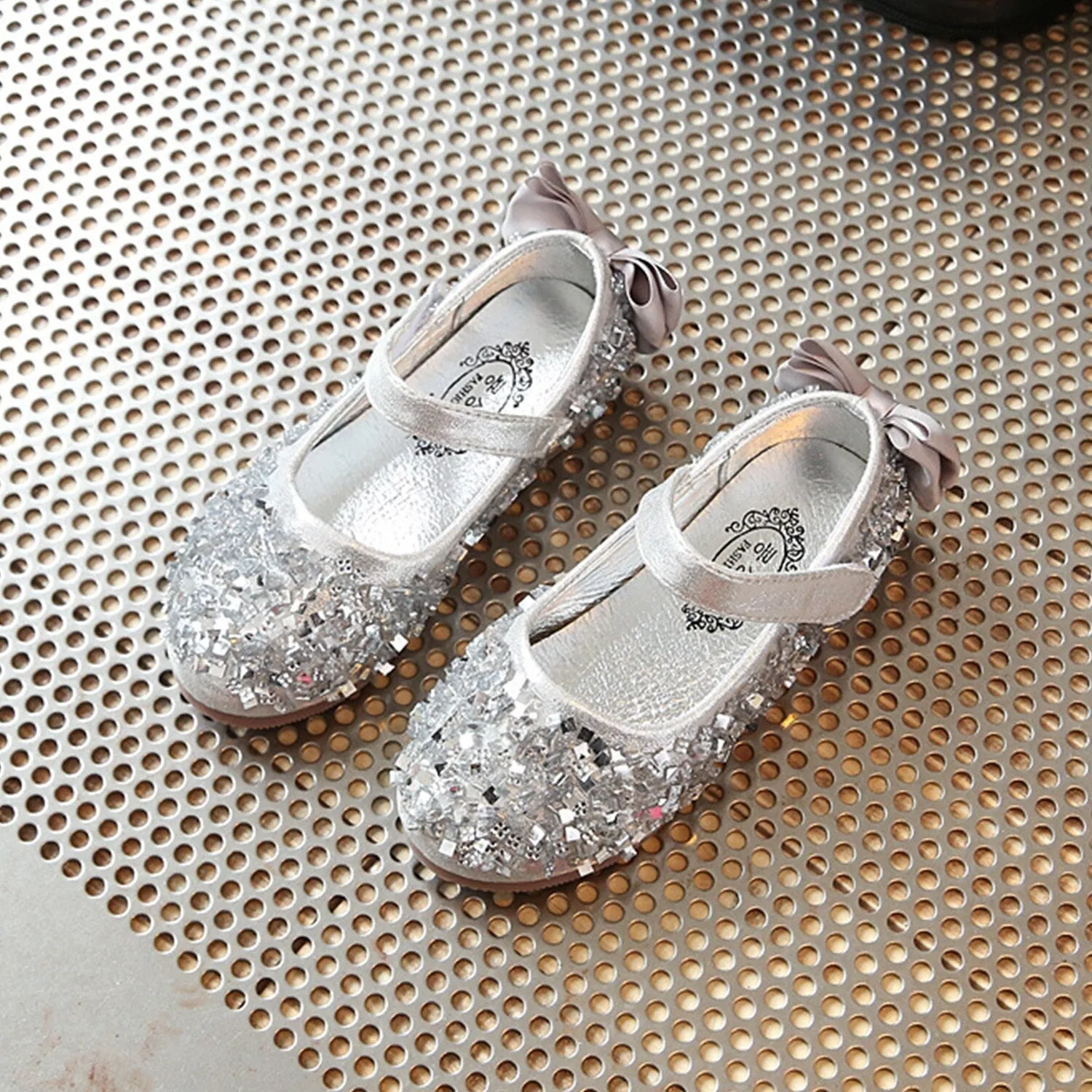 Silver Sequins Girls' Flat Shoes sold by Zulily