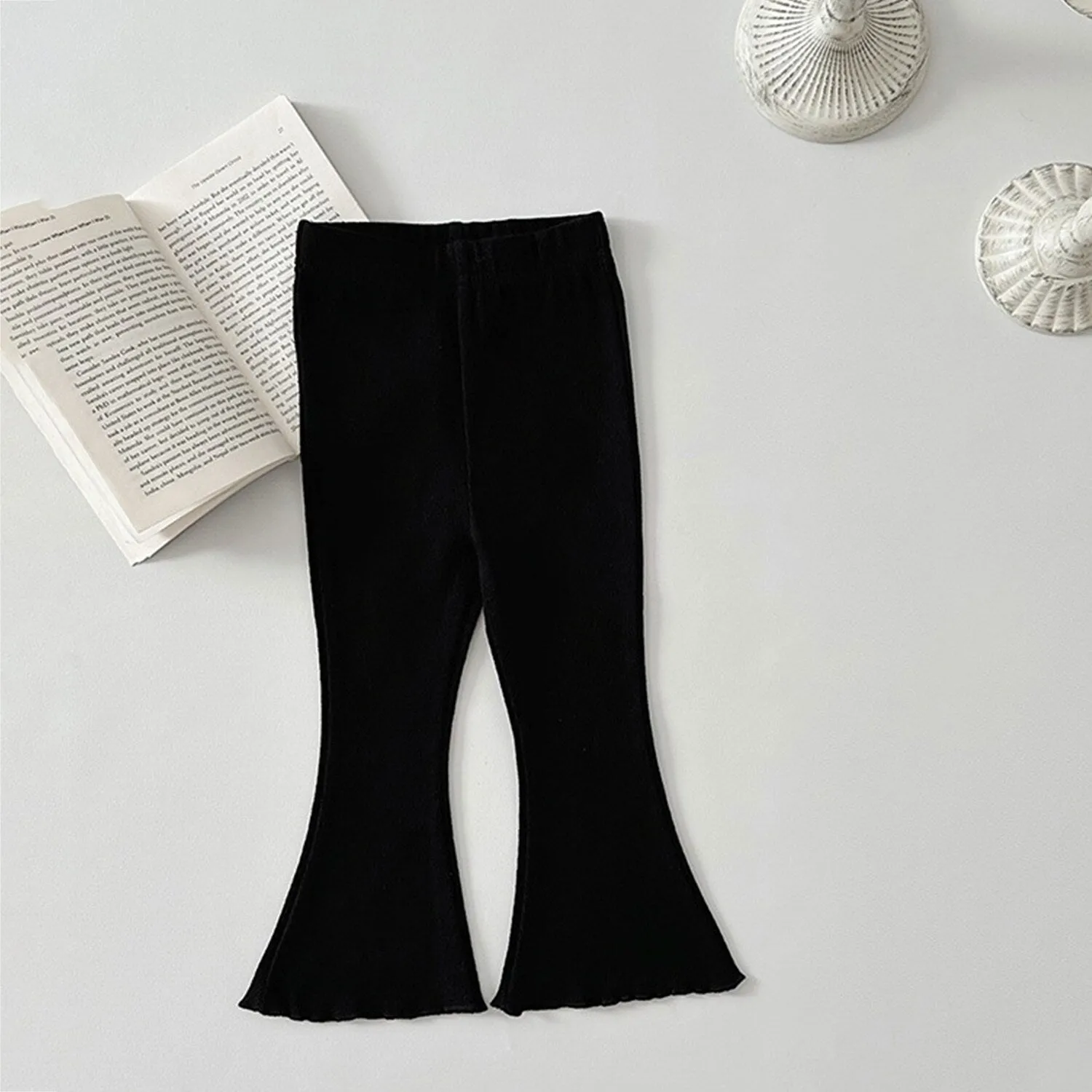 Black Flared Pants sold by Zulily