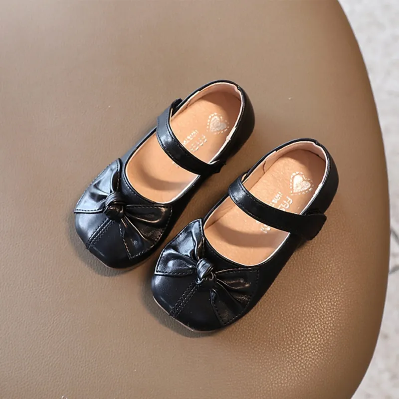 Black Bow Girls' Flat Shoes sold by Zulily