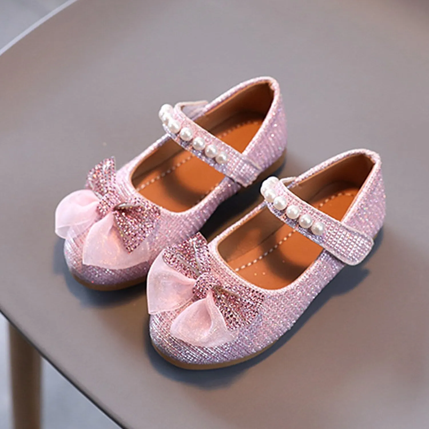 Pink Rhinestone Bow Girls' Flat Shoes sold by Zulily