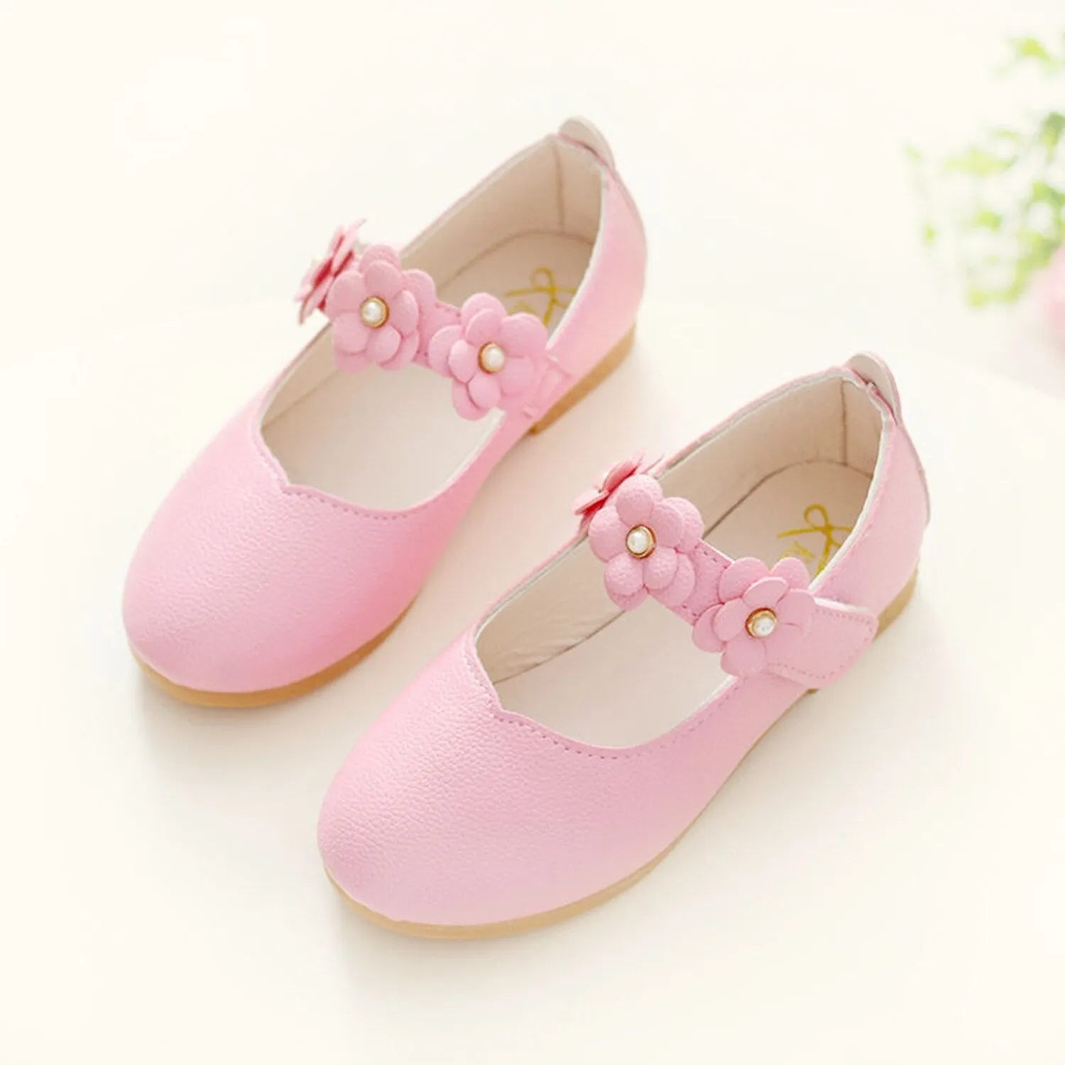 Light Pink Floral Girls' Flat Shoes sold by Zulily