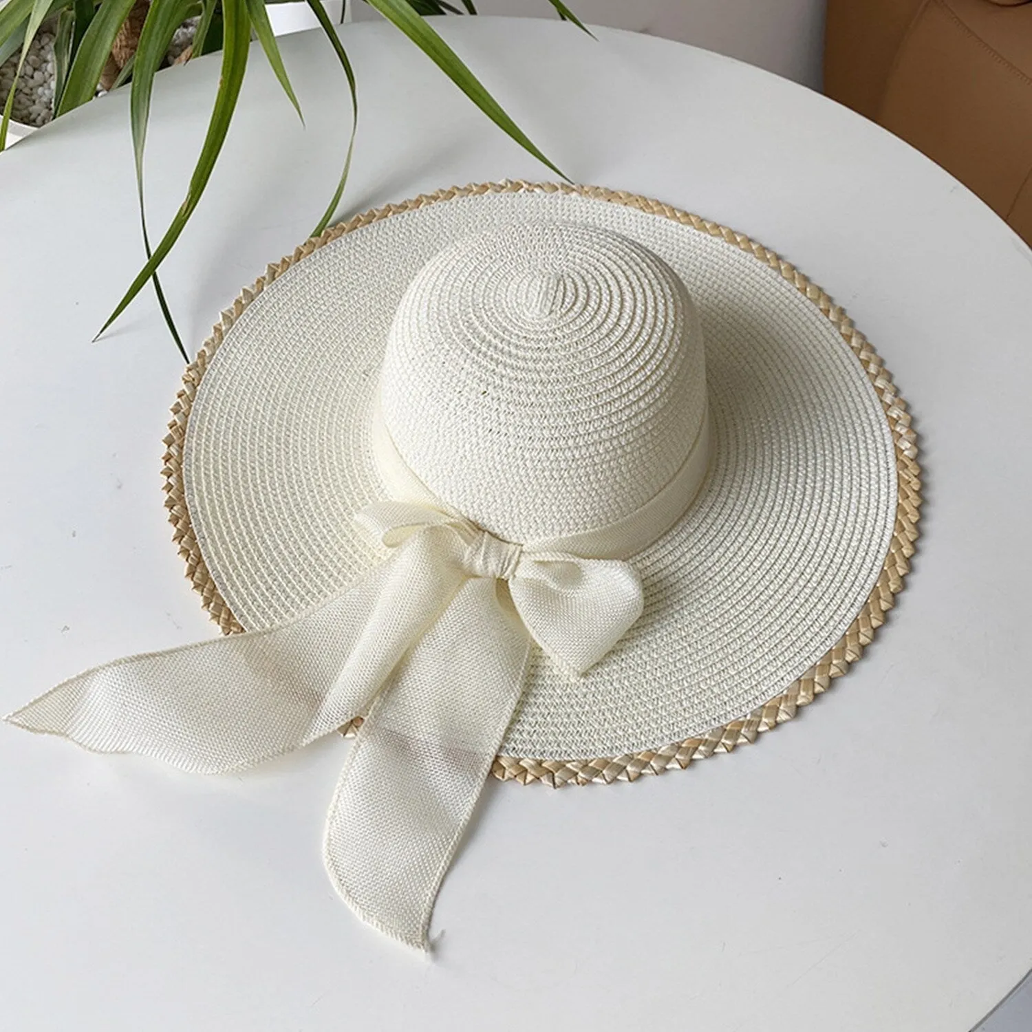 Cream Bow-Accent Sun Hat sold by Zulily