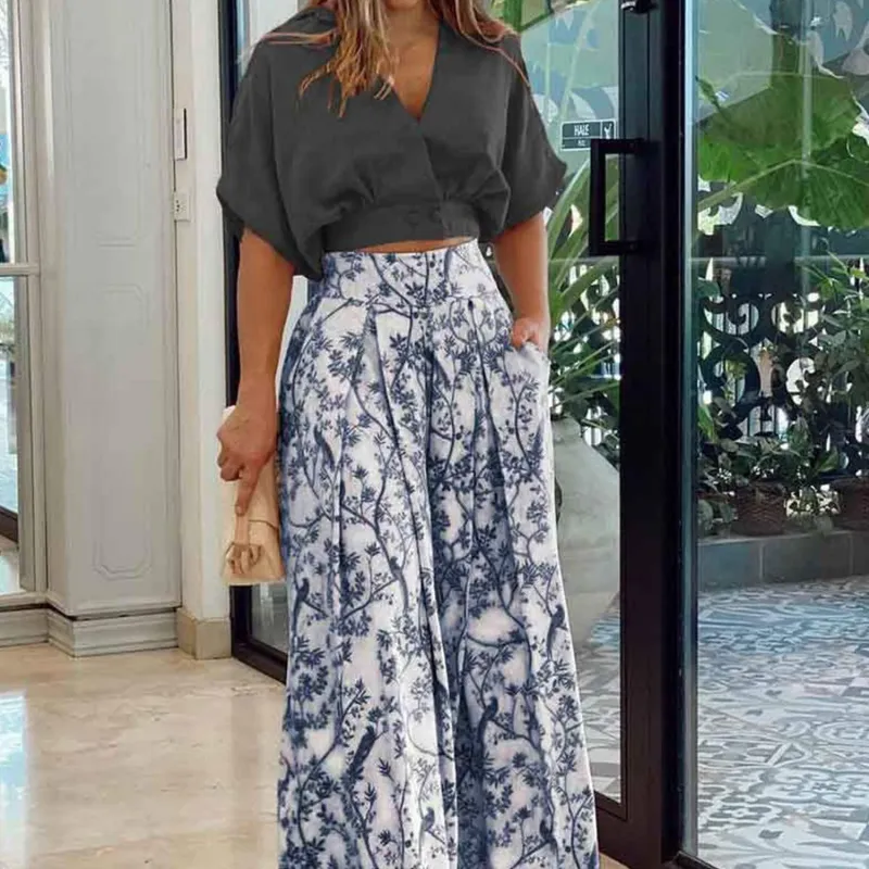 Black V-Neck Crop Top & Floral Wide-Leg Pants sold by Zulily