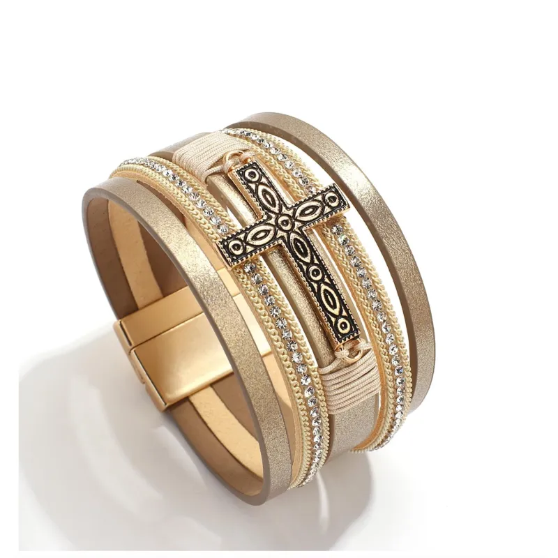 Goldtone Imitation Leather Boho Cross Bracelet sold by Zulily