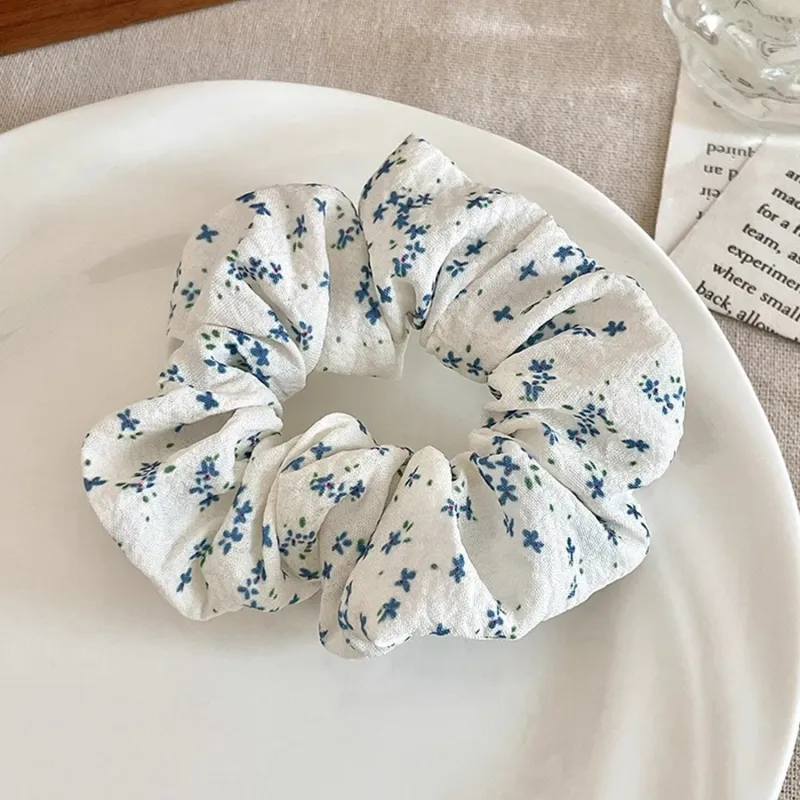 White & Blue Floral Hair Tie sold by Zulily