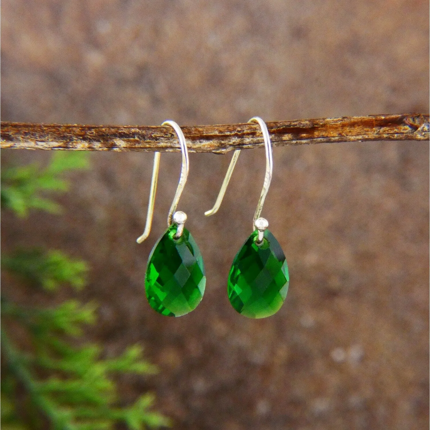 Sterling Silver Earring with Teardrop Emerald Green Crystal sold by Zulily