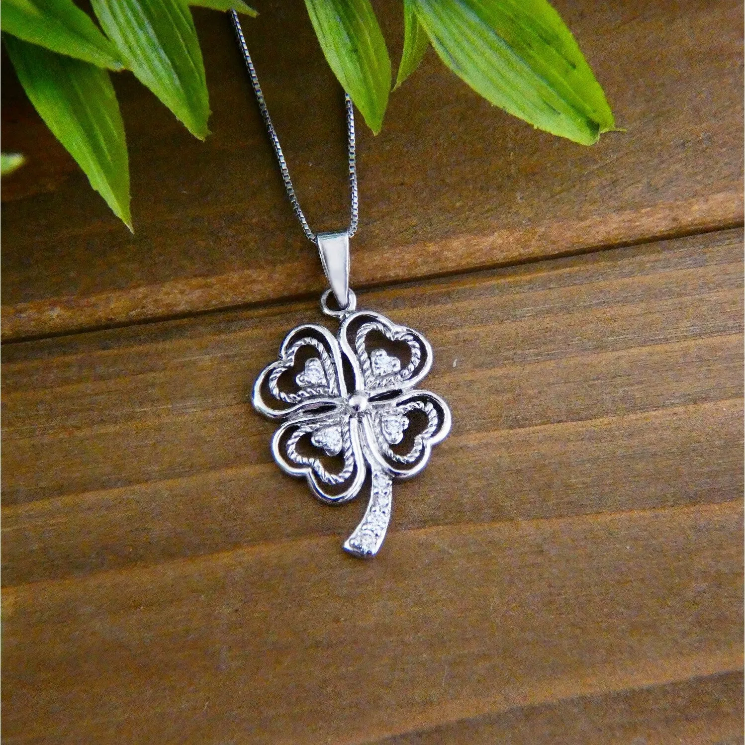 Sterling Silver Clover Layer line with tiny hearts Charm Necklace sold by Zulily