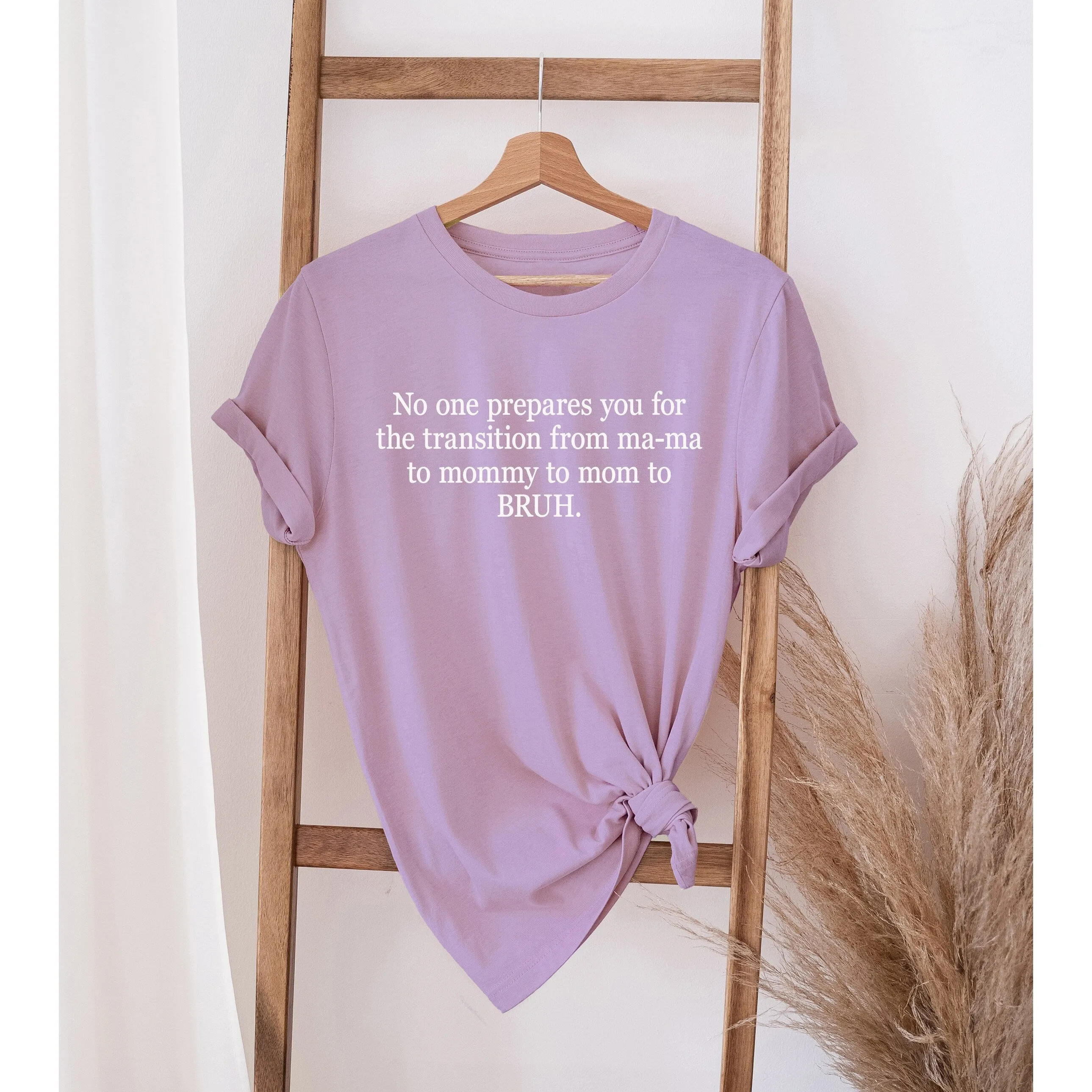 No one prepares you for the transition from MA-MA TO MOMMY TO MOM TO BRUH women's oversized tee sold by Zulily
