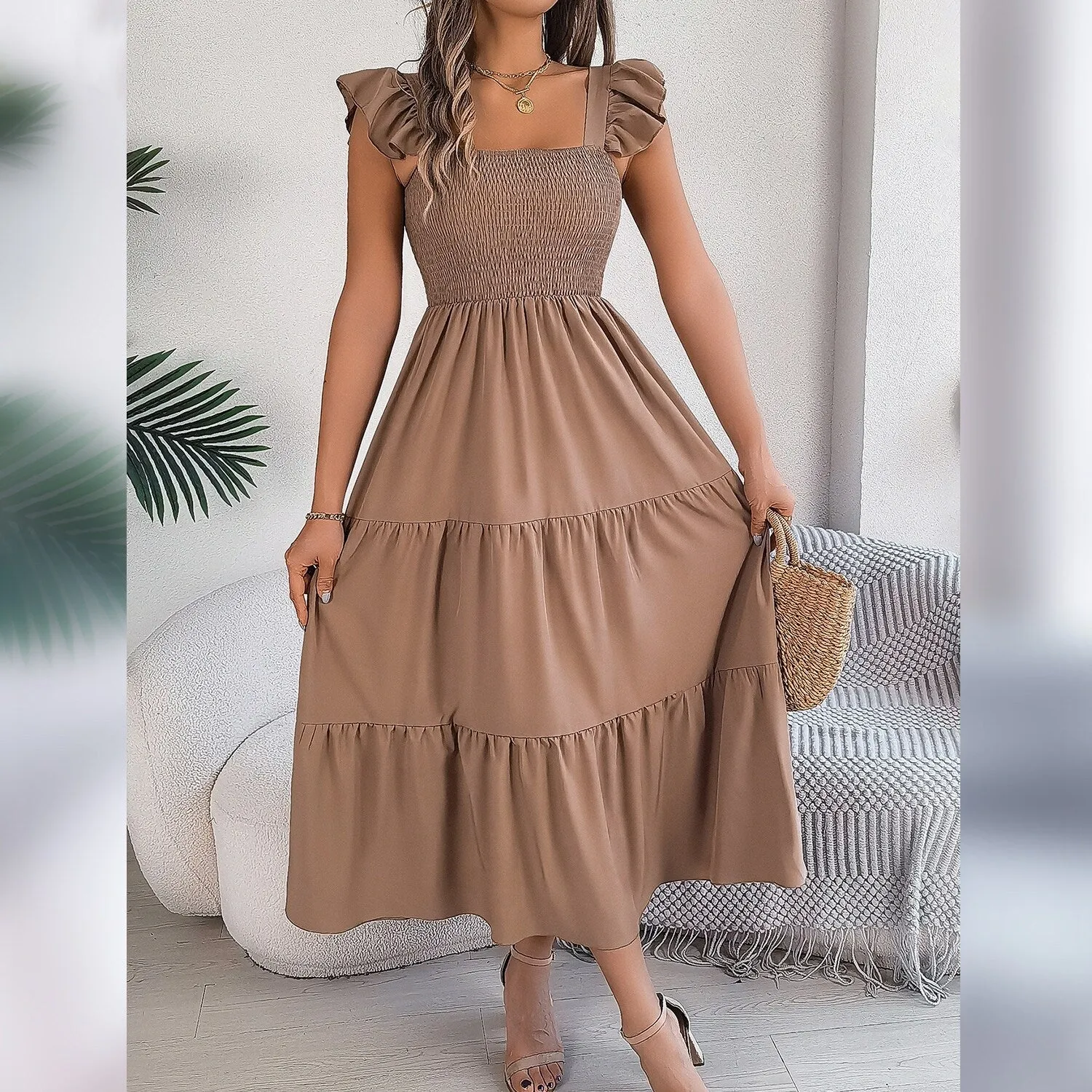 Khaki Ruffle-Sleeve Smocked Tiered Dress sold by Zulily