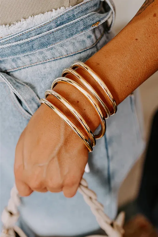 Gold Multi Layer Bangle Bracelet by Threaded Pear sold by Zulily