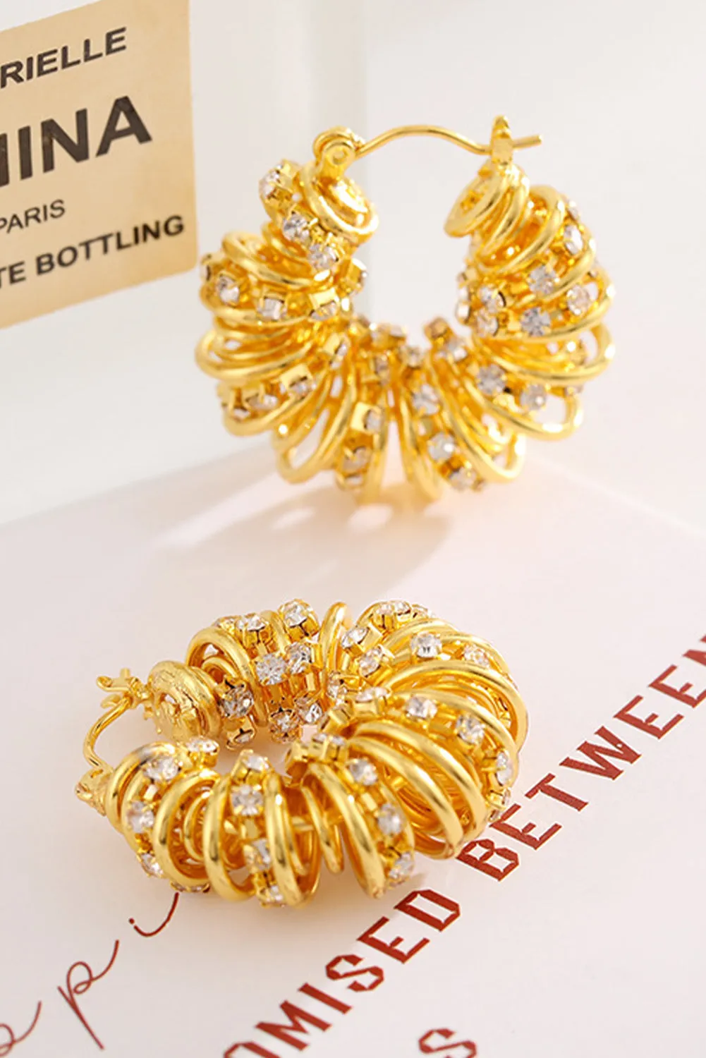 White Rhinestone Spiral Earrings by Threaded Pear sold by Zulily product image thumbnail 3