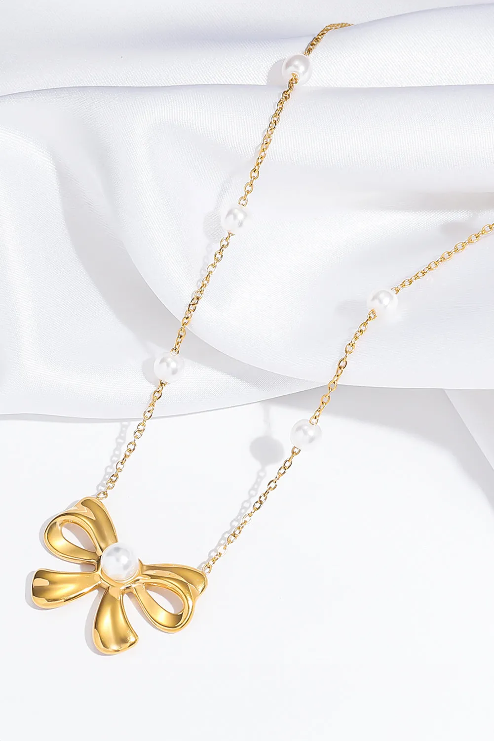 Gold Pearl Decor Plated Bow Knot Pendant Necklace by Threaded Pear sold by Zulily product image thumbnail 3