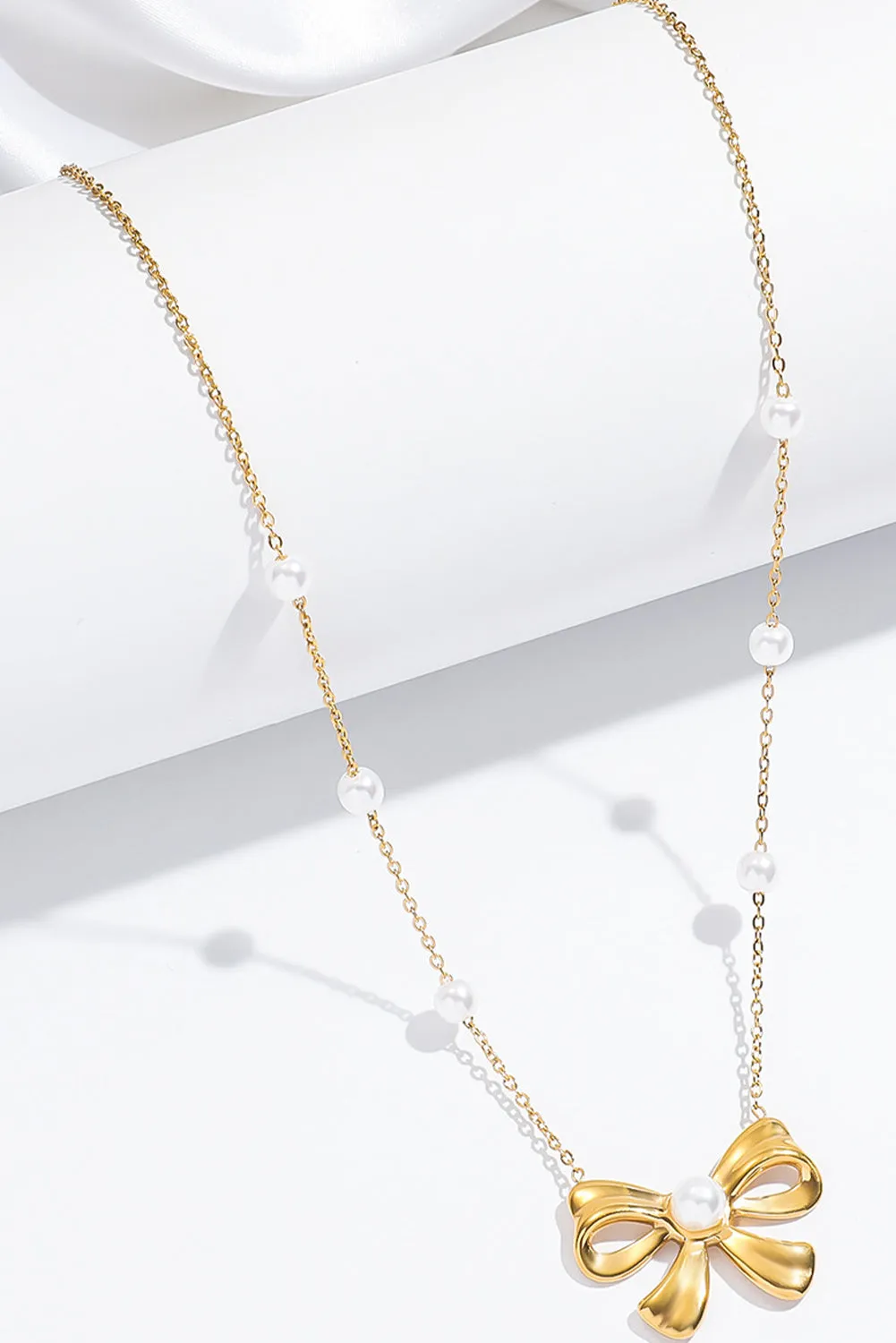 Gold Pearl Decor Plated Bow Knot Pendant Necklace by Threaded Pear sold by Zulily product image thumbnail 2