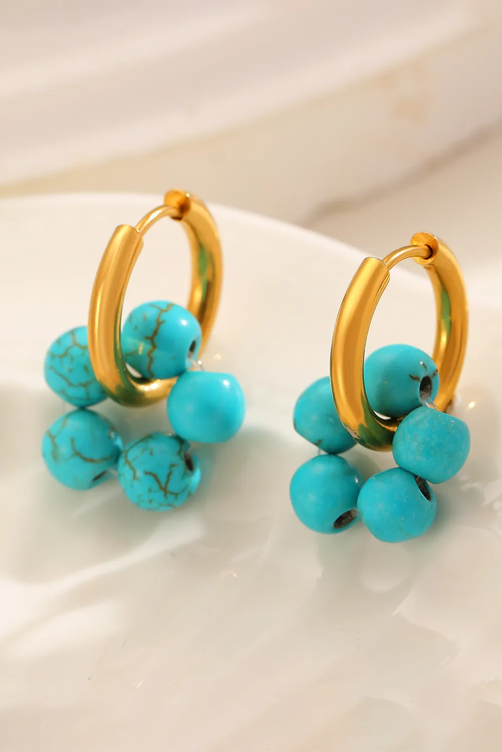 Turquoise Flower Shape Hoop Earrings by Threaded Pear sold by Zulily product image thumbnail 2