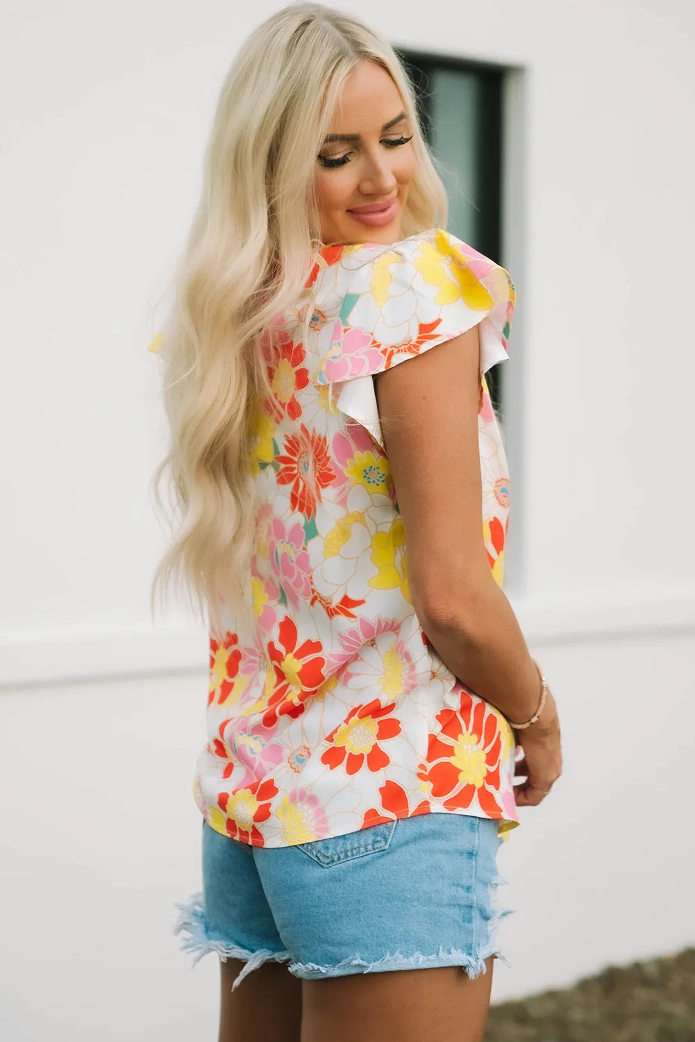 Judith Multicolor Flutter Sleeves Floral Blouse by Threaded Pear sold by Zulily product image thumbnail 3