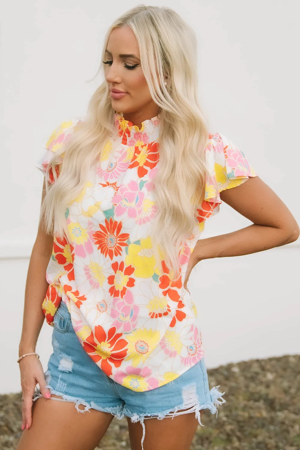 Judith Multicolor Flutter Sleeves Floral Blouse by Threaded Pear sold by Zulily product image thumbnail 4