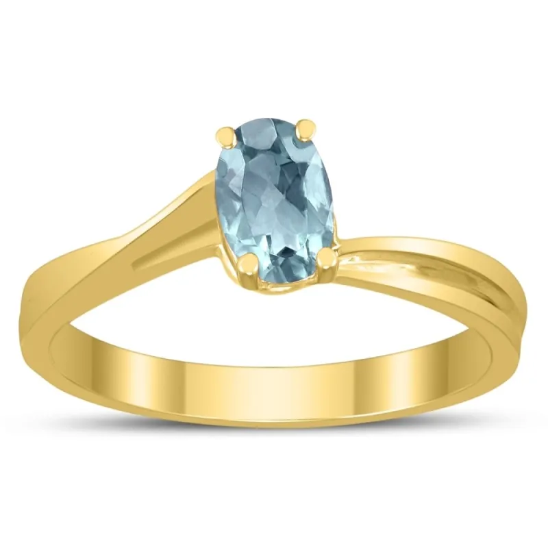 Solitaire Oval 6X4MM Aquamarine Gemstone Twist Ring in 10K Yellow Gold made by Zulily