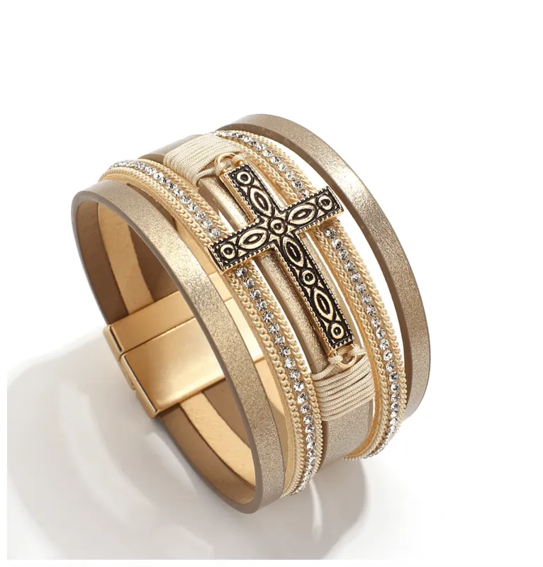 Goldtone Imitation Leather Boho Cross Bracelet sold by Zulily