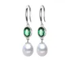 White Freshwater Pearl Drop Earrings With Emerald Oval Cubic Zirconia sold by Zulily