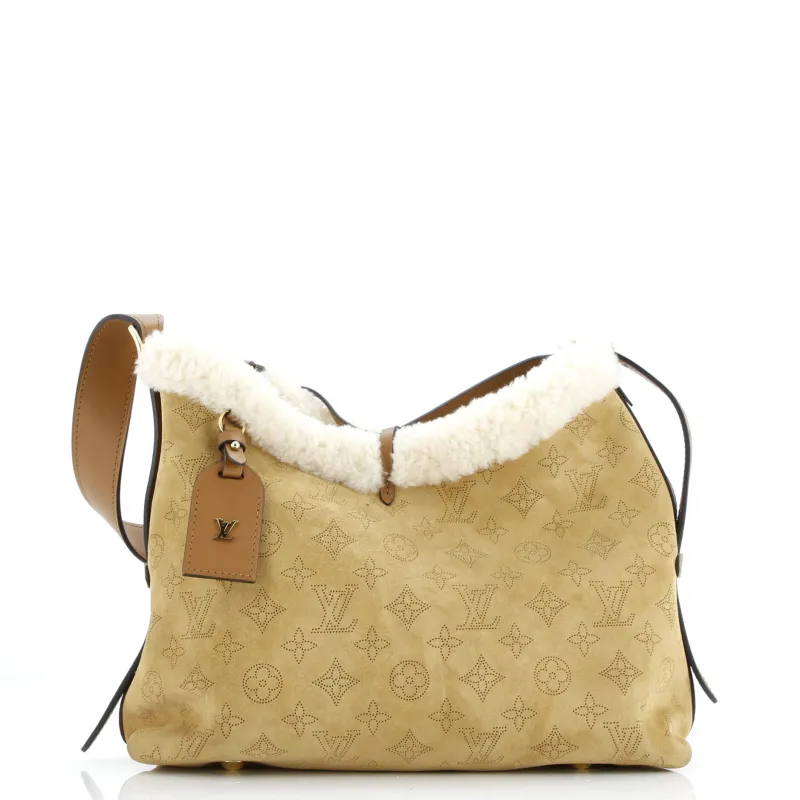Pre-Loved Louis Vuitton CarryAll Hobo Mahina Suede with Shearling PM sold by Zulily
