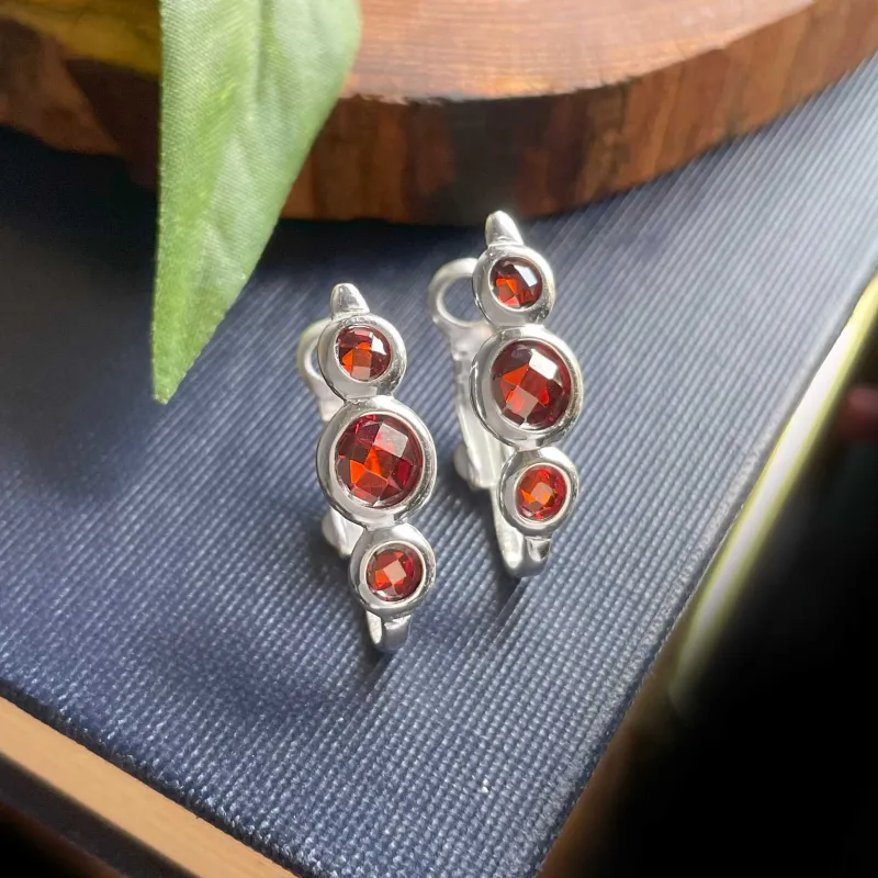 Vera & Co Sterling Silver Trio Red CZ Huggie Women's Earring sold by Zulily