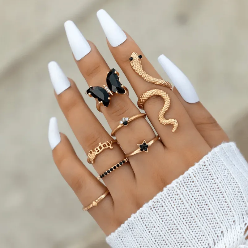 Goldtone & Black Butterfly and Snake Ring Set sold by Zulily