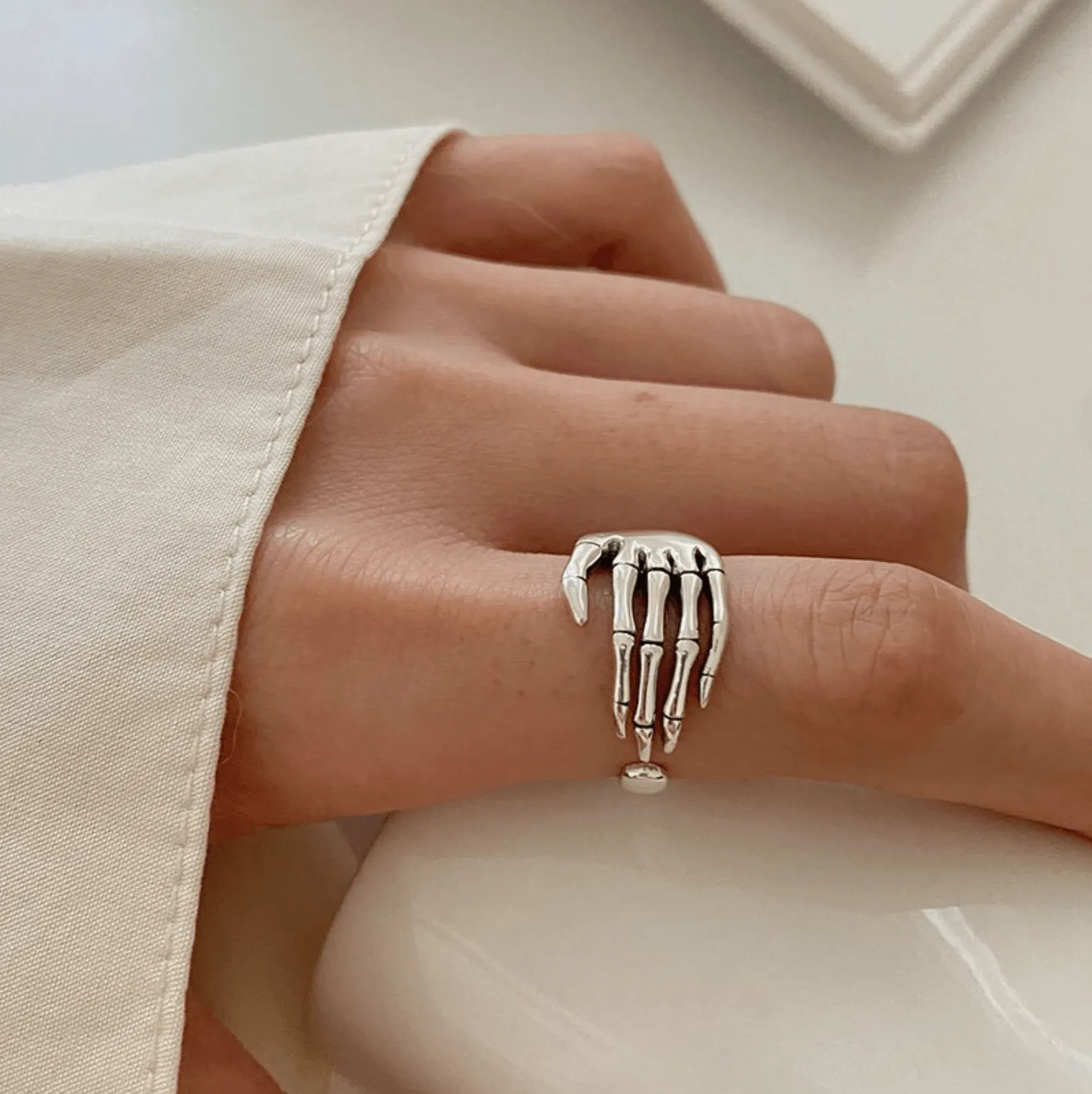 Adjustable Silvertone Skeleton Hand Ring sold by Zulily