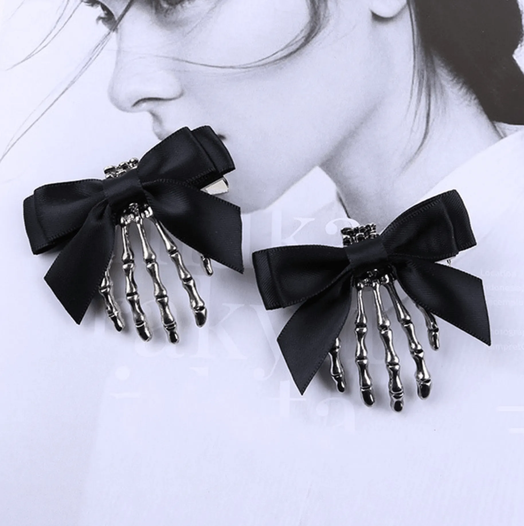 Black Bow & Silver Skeleton Hand Earrings sold by Zulily product image thumbnail 2