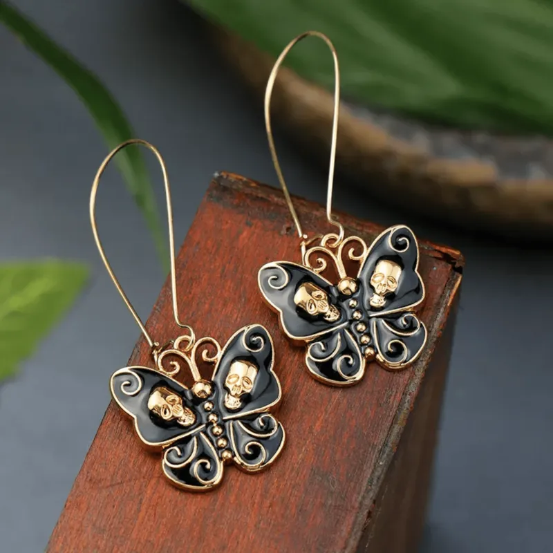 Black Skull Butterfly Earrings sold by Zulily