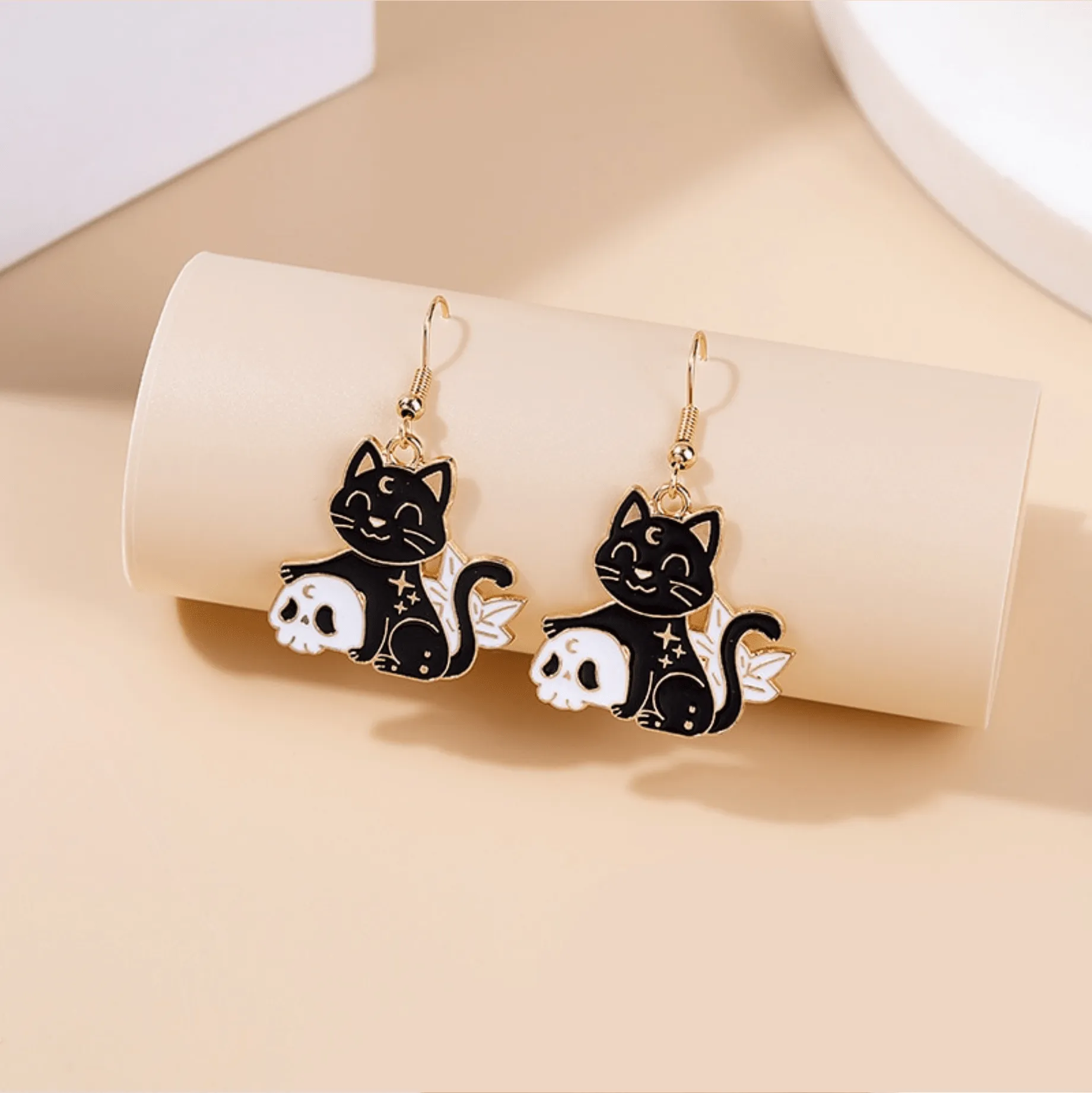 Black Celestial Cat Skeleton Drop Earrings sold by Zulily