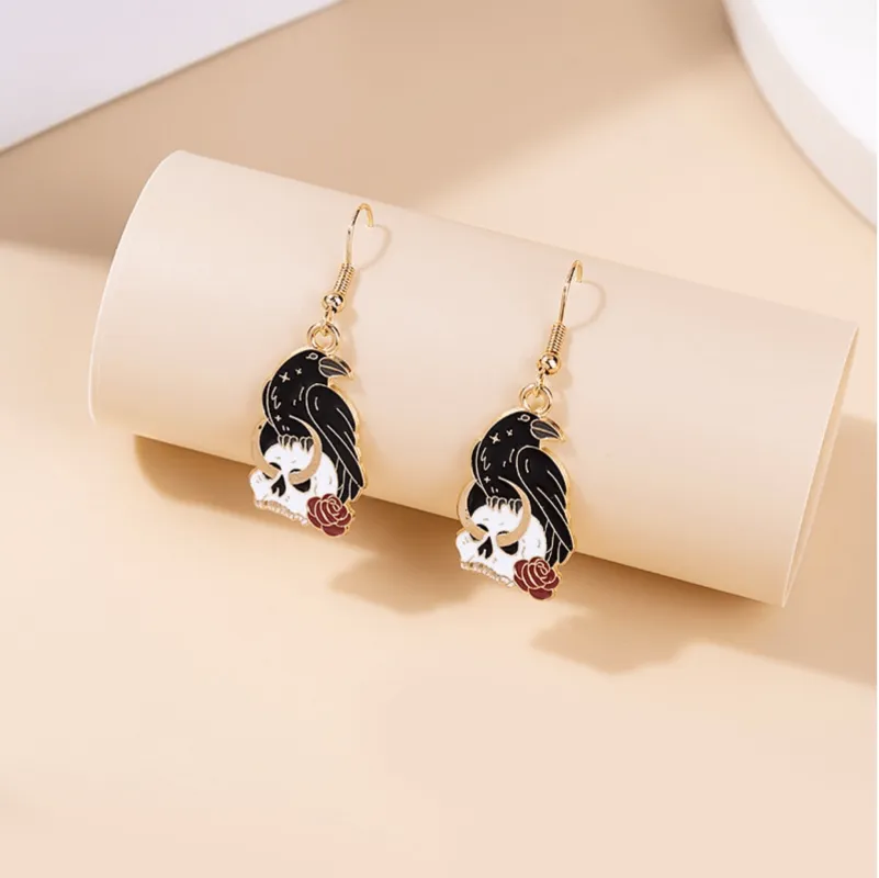 Black Raven With Rose Skeleton Drop Earrings sold by Zulily