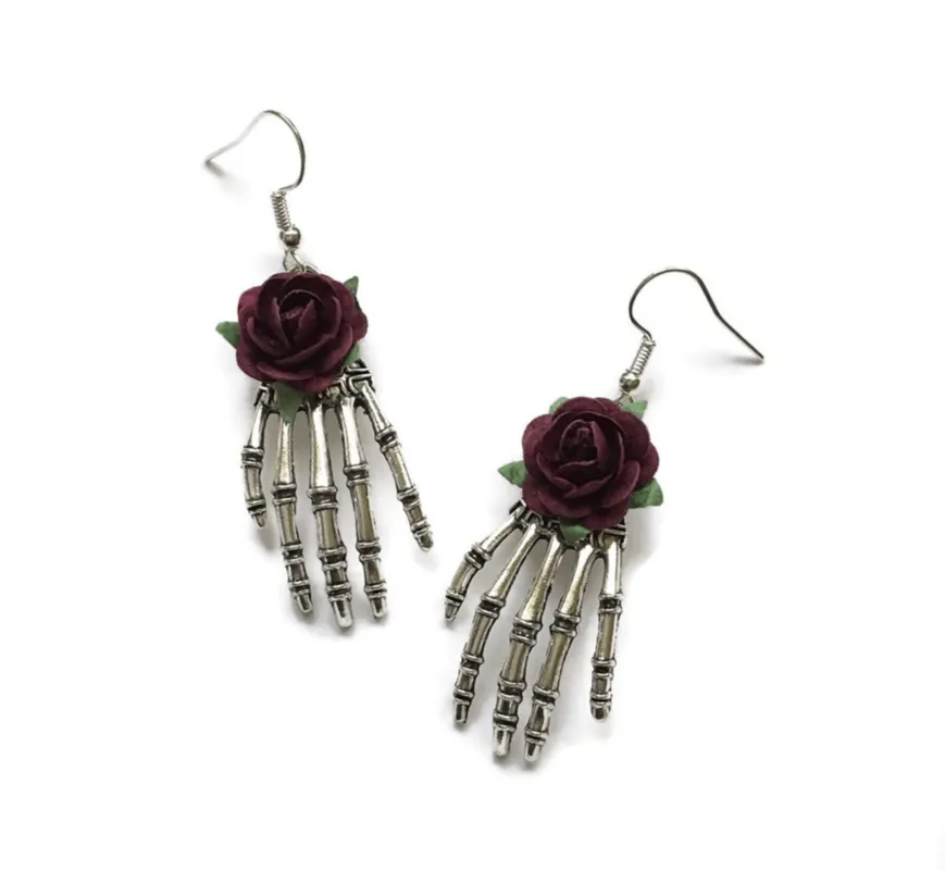 Silvertone Skeleton Hand With Dark Rose Earrings sold by Zulily