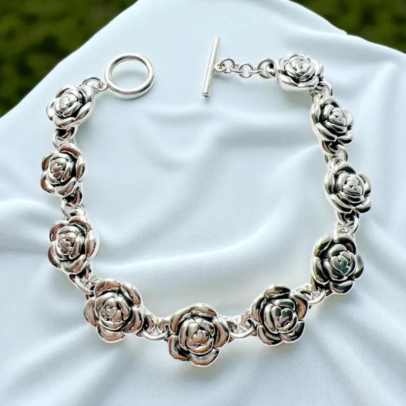 Vera & Co Sterling Silver Small Rose Flower Links Women Bracelet with Toggle Closure sold by Zulily