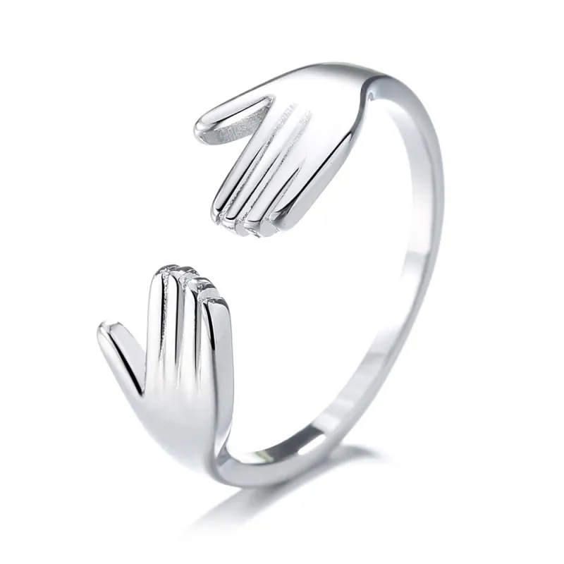 Amy and Annette Sterling Silver Hugging Hands Adjustable Ring sold by Zulily