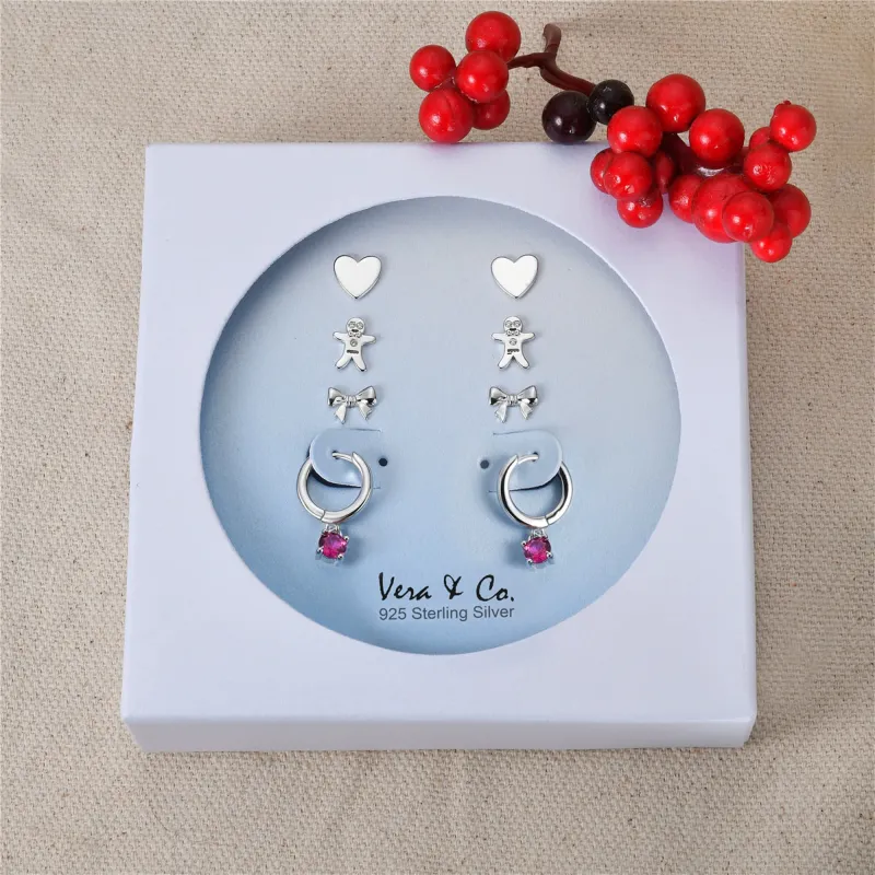 Sterling Silver Holiday Earring Set of Heart Stud, Gingerbread Man Stud, Bow Tie Stud, A drop of Red CZ Huggie Hoop sold by Zulily