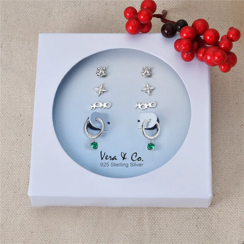Sterling Silver Holiday Earring Set of Hoho Wording Stud, Starburst Stud, Jingle Bell Stud, A Drop of Green CZ Huggie Hoop sold by Zulily