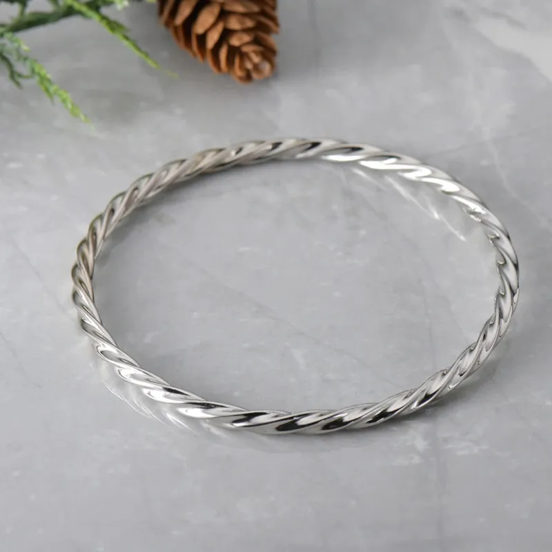 Sterling Silver Twisted Texture Close Bangle sold by Zulily