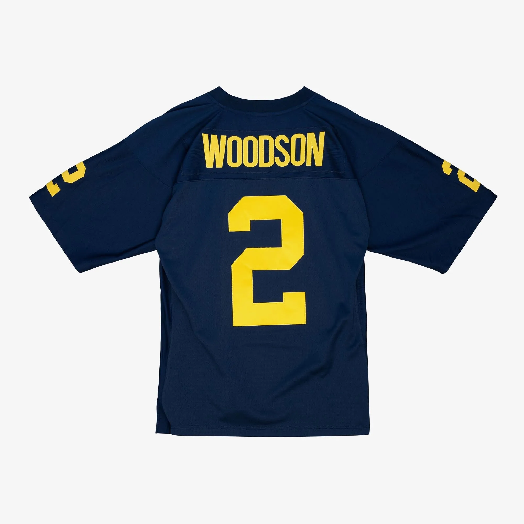 Men's Mitchell & Ness Ncaa Dark Jersey Michigan 1997 Charles Woodson sold by Zulily