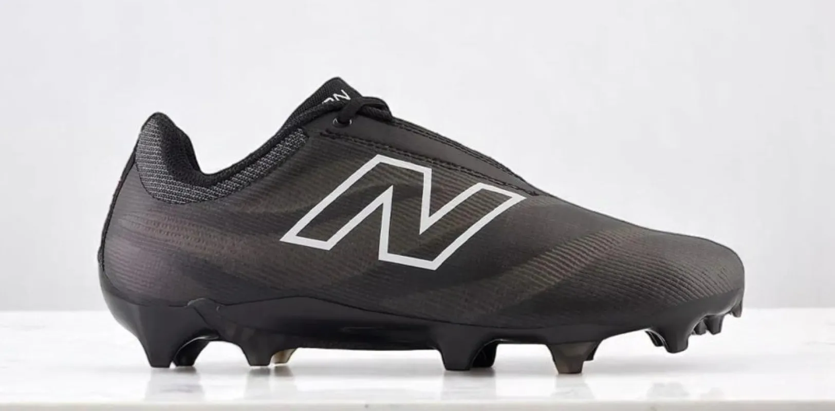 New Balance Men's Burn X4 'Black White' Sneakers sold by Zulily