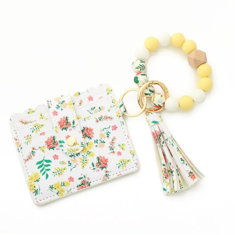 Yellow Pink Floral Card Holder And Beaded Stretch Bracelet Keychain sold by Zulily