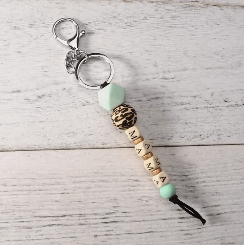 Turquoise & Cheetah Wood Beaded Mama Keychain made by Zulily