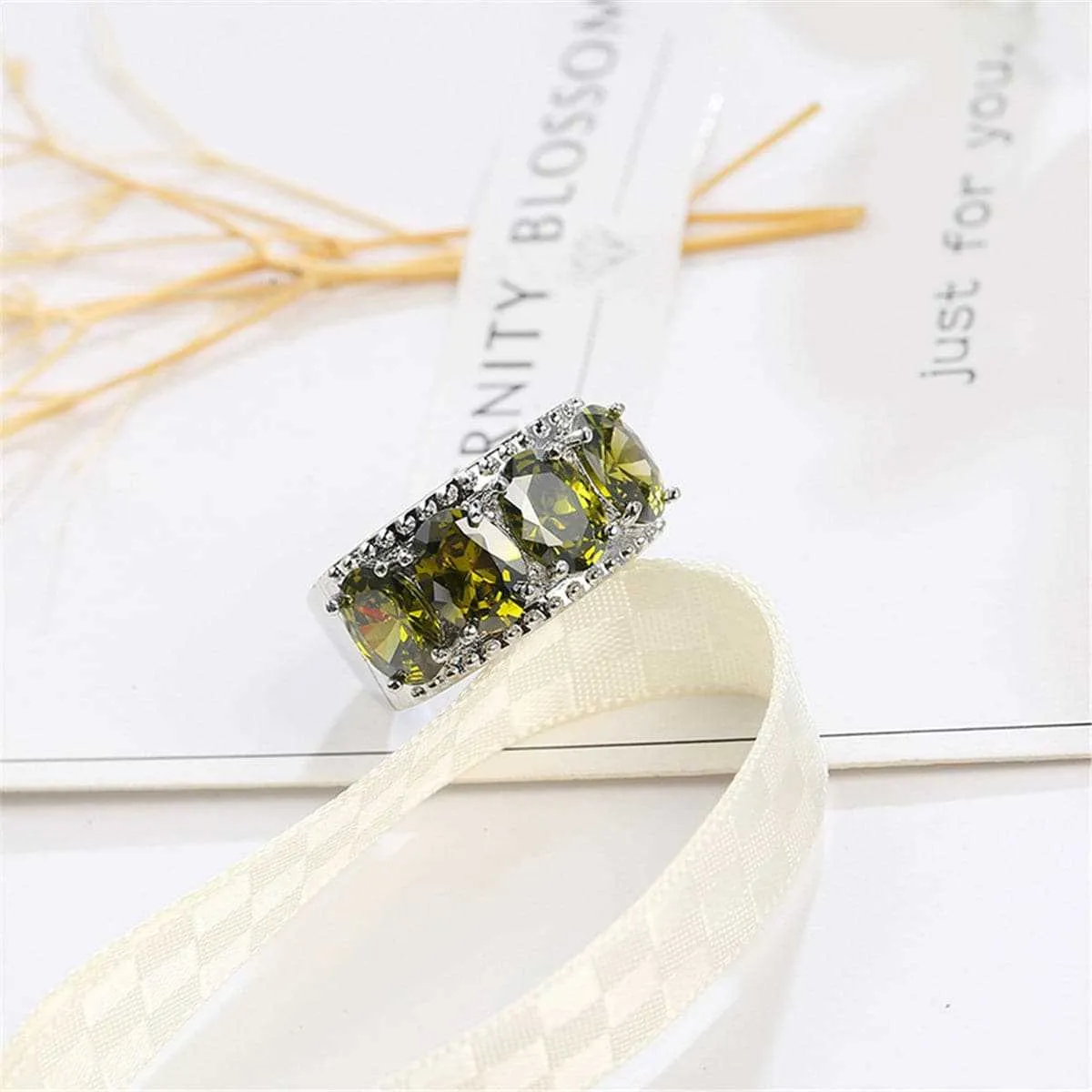 Olive Crystal & Silvertone Prong Ring sold by Zulily