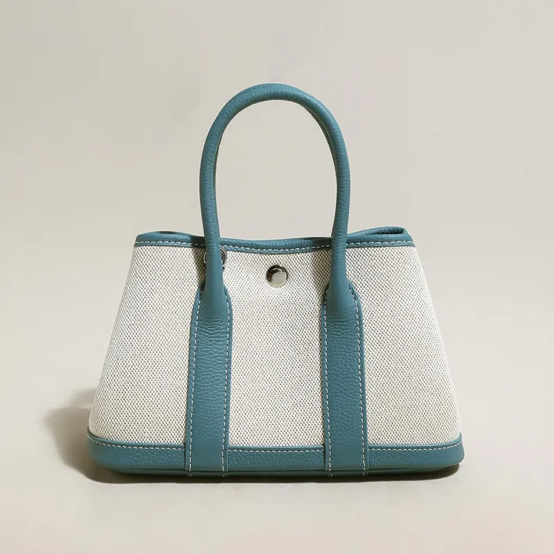 Carefree Canvas and Leather Top Handle Bag made by Zulily