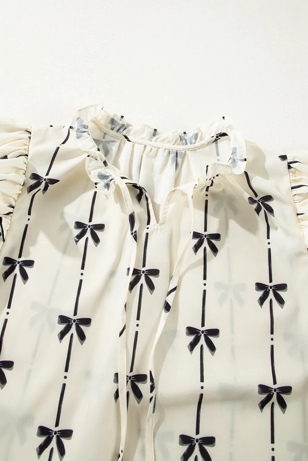 Threaded Pear Maisie Bow Bubble Sleeve Blouse sold by Zulily product image thumbnail 3