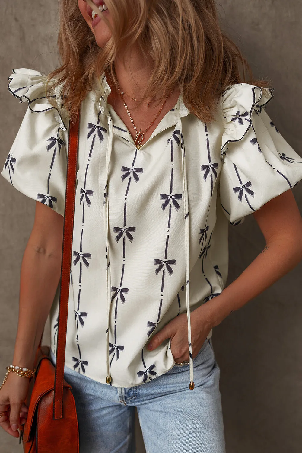 Threaded Pear Maisie Bow Bubble Sleeve Blouse sold by Zulily