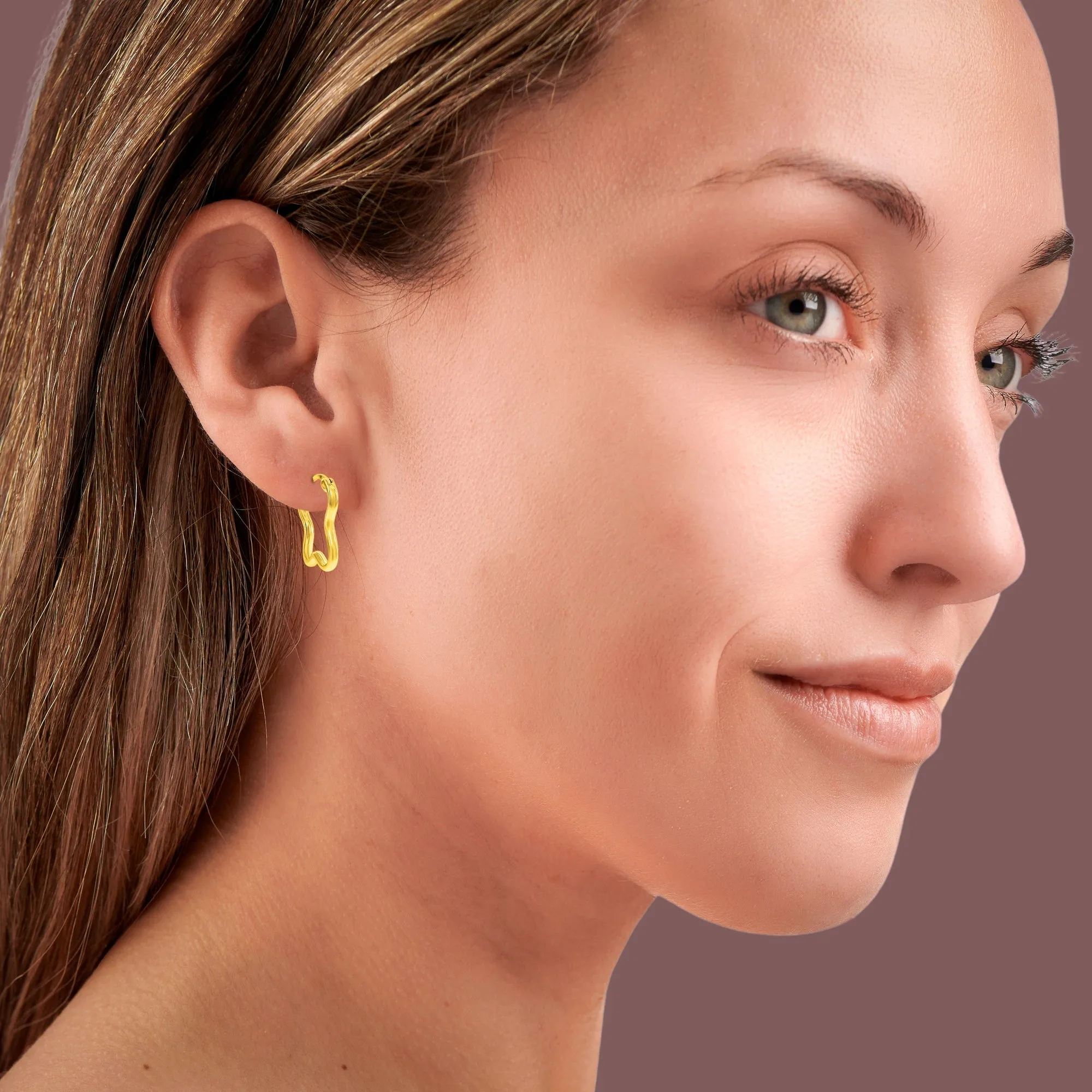The " Wave" Gold Hoop Earrings sold by Zulily product image thumbnail 2